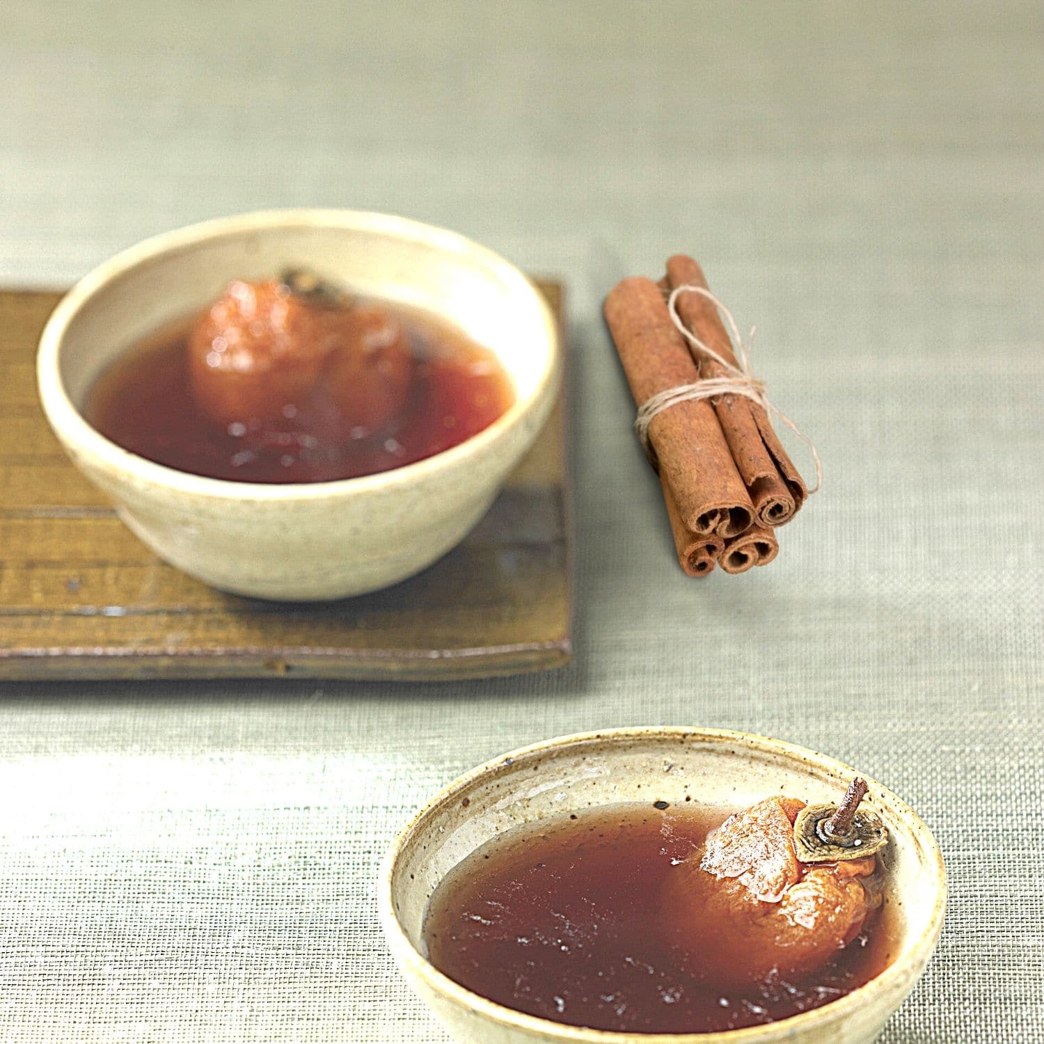Korean Punch in bowls with cinnamon sticks