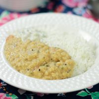 plate of Kalonji Dal - Nigella Seed Da with rice and raita