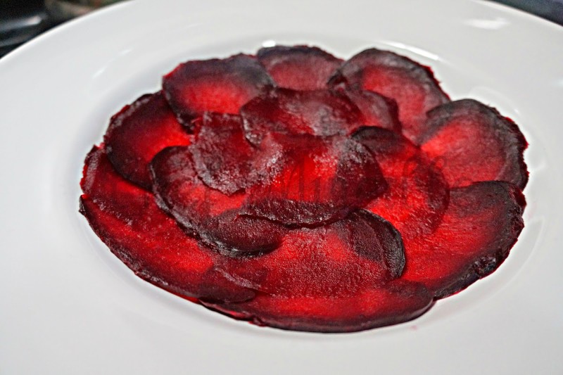 Thinly sliced beets placed as base of salad.