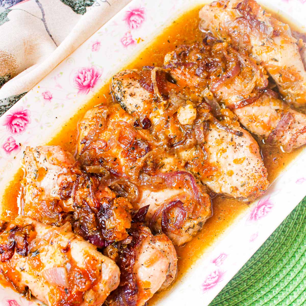 plate of cooked pork chops with sauce