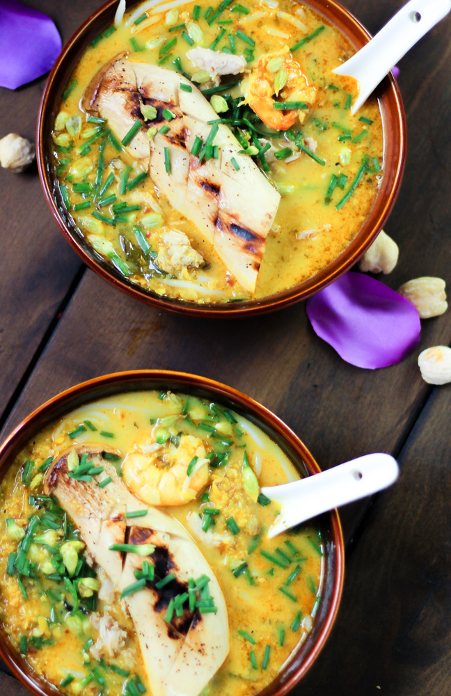 bowls of laksa soup with shrimp and mushrooms in coconut curry