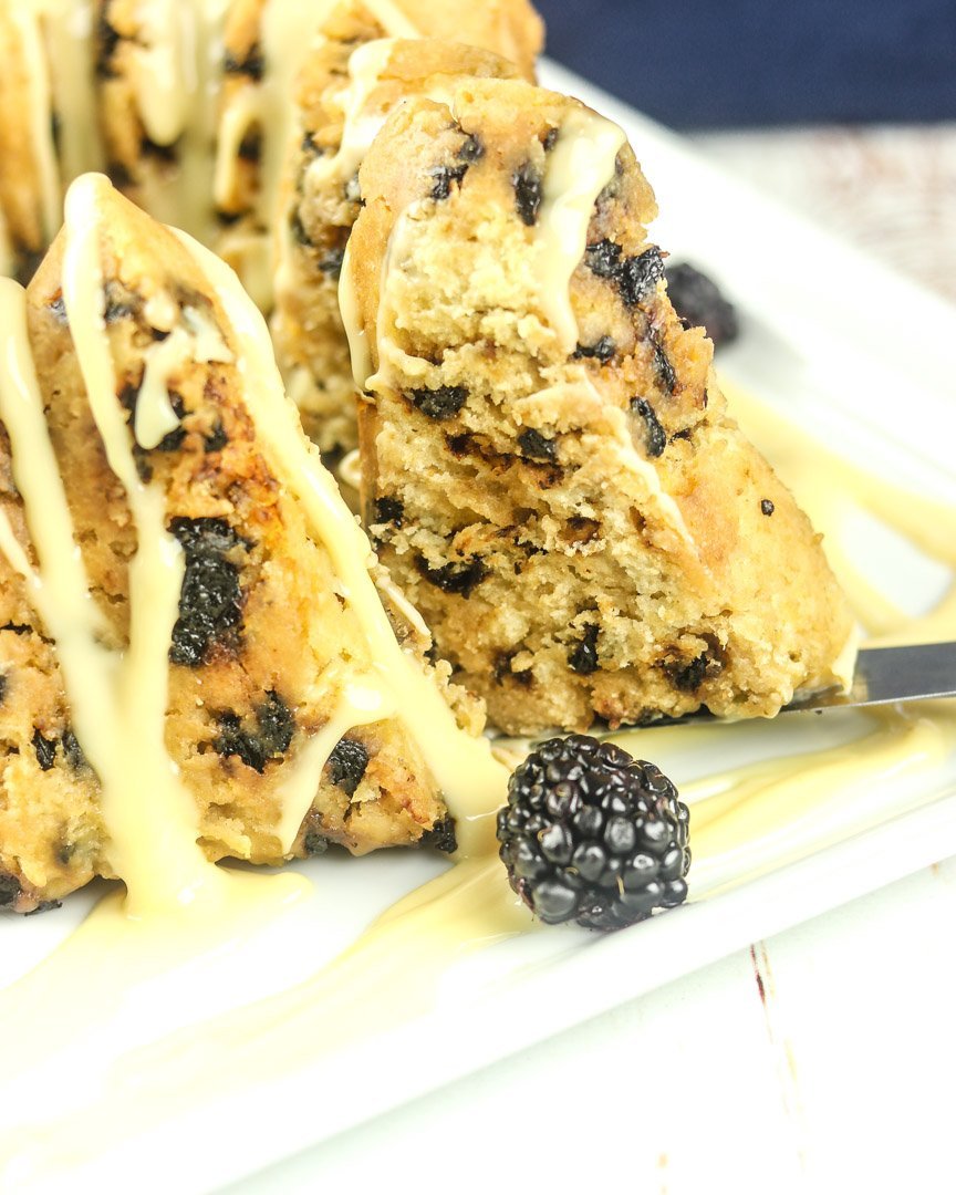  plate of steamed pudding with berries and custard