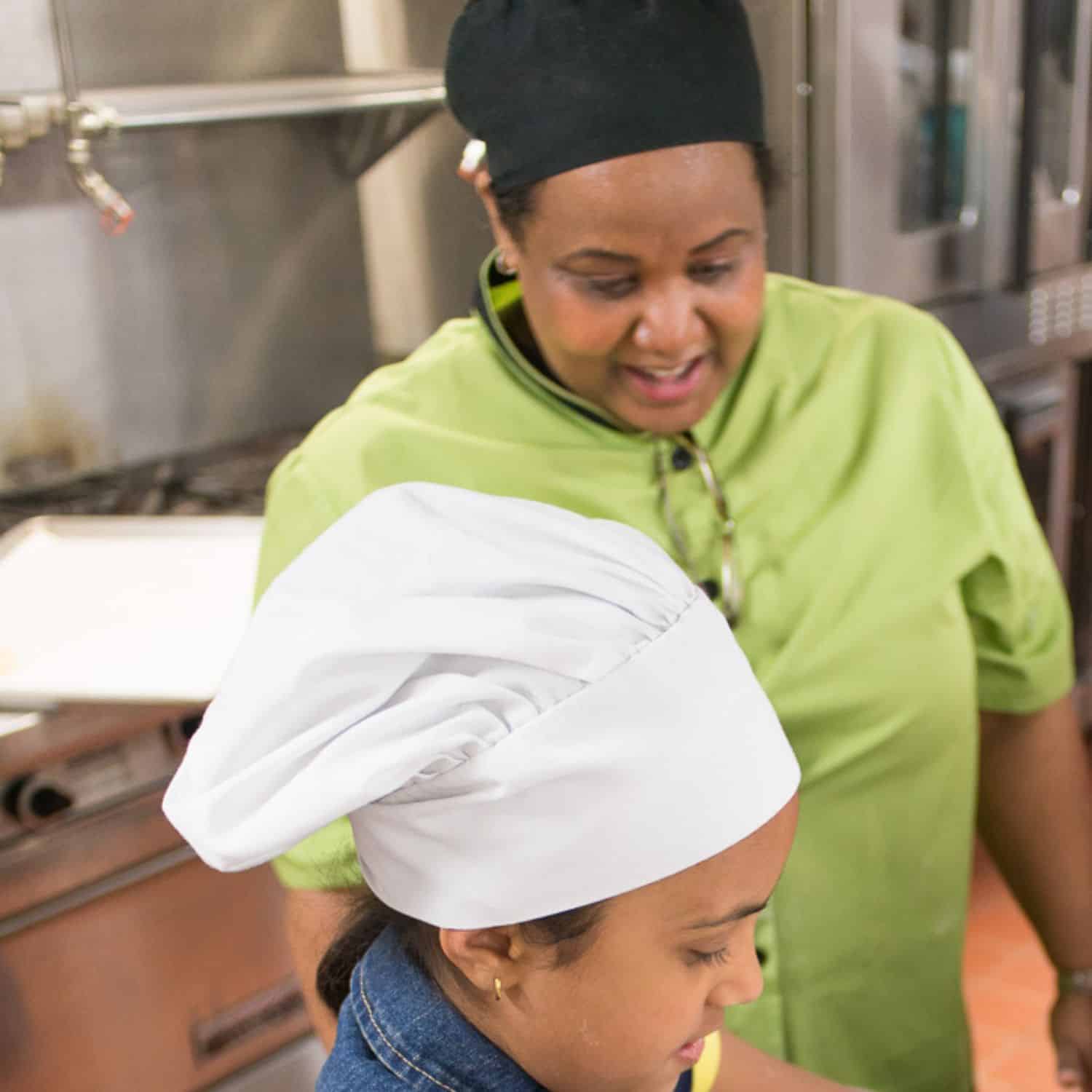 chef and child student with chefs cap