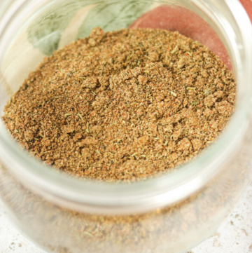 dry rub spice blend in a jar with text for Pinterest