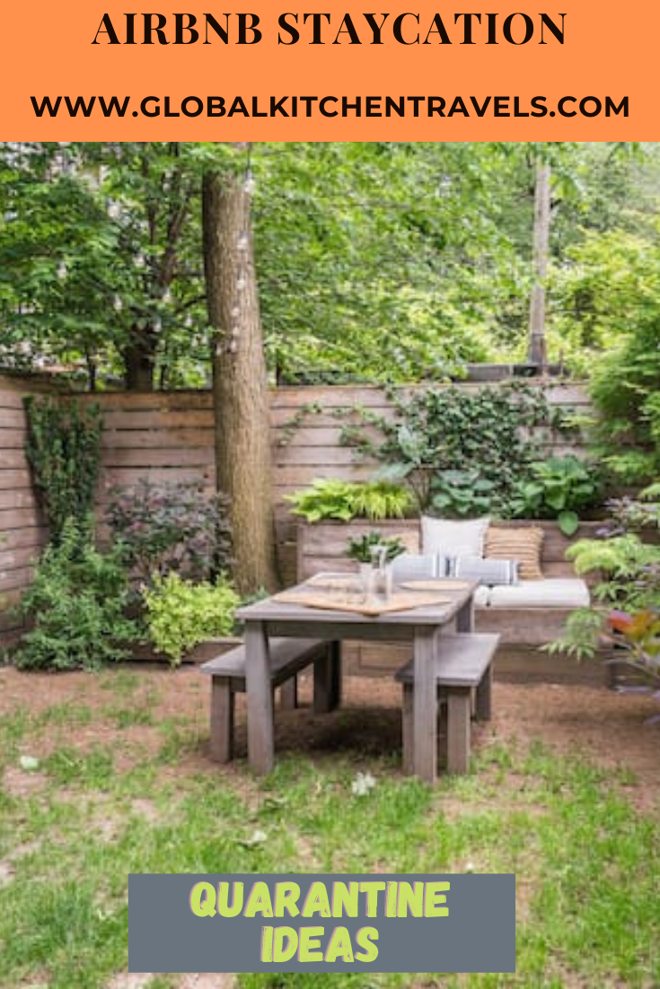 garden with table and bench and text