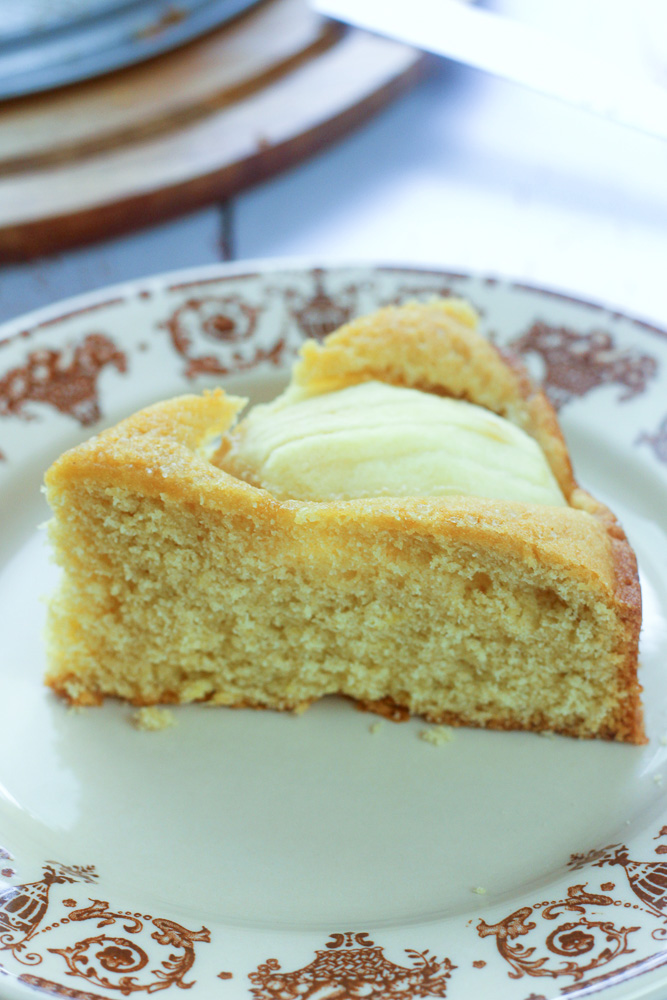 Slice of sunken apple cake on a plate