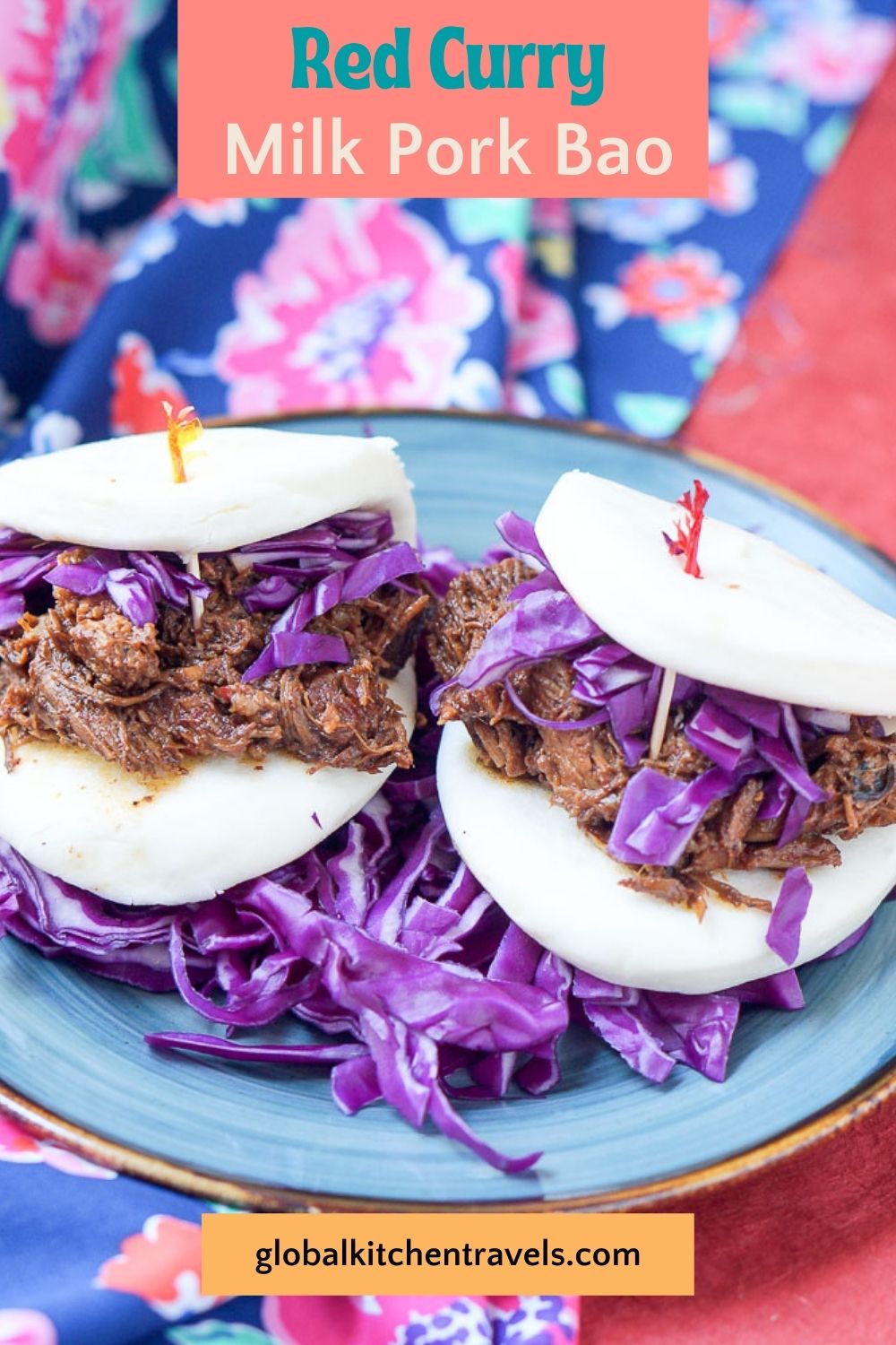 2 milk pork bao sandiwches on a plate with red cabbage