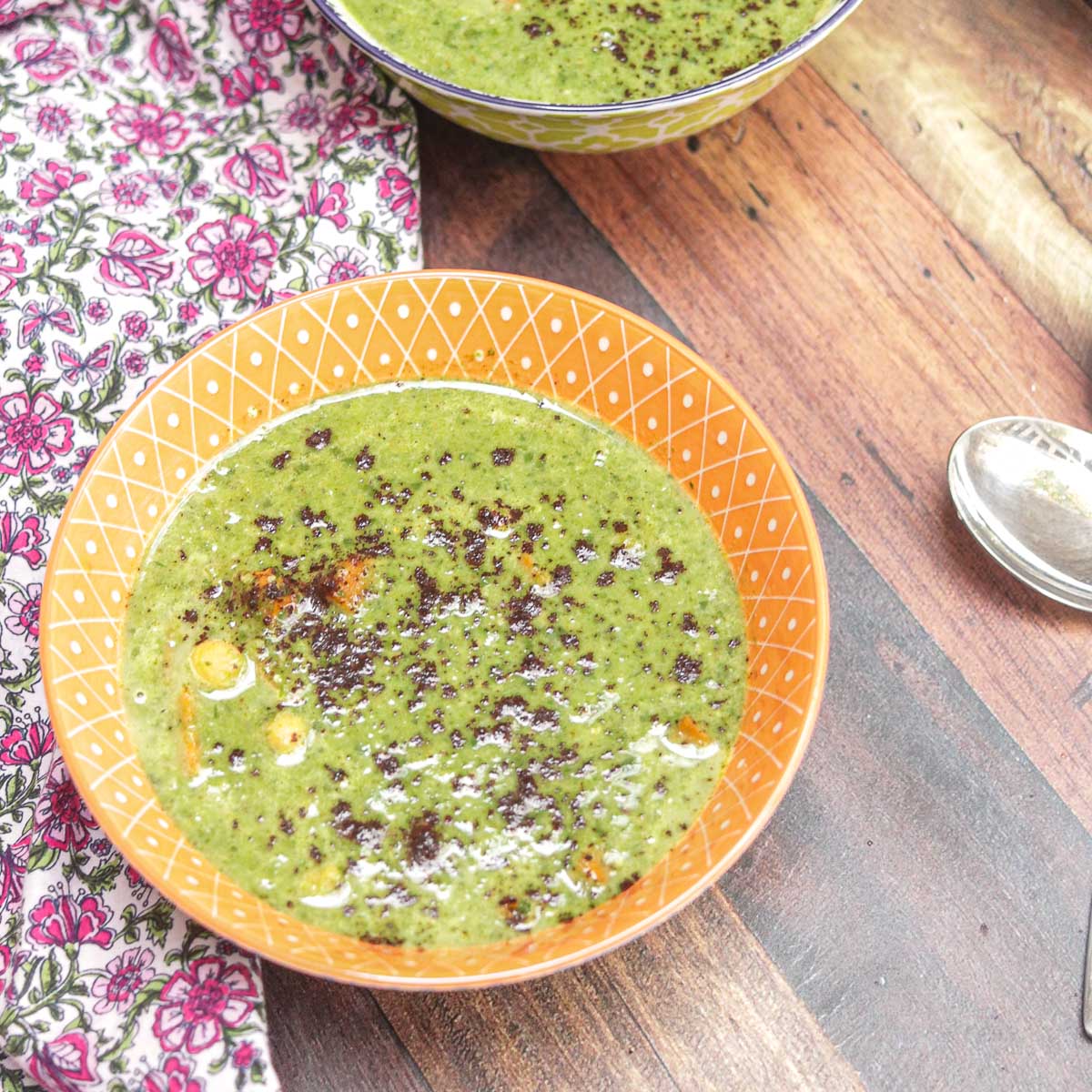 bowl of spinach soup with spoon