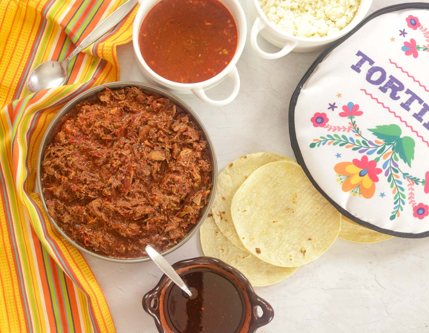 Goat Birria - consome - tortillas and salsa.