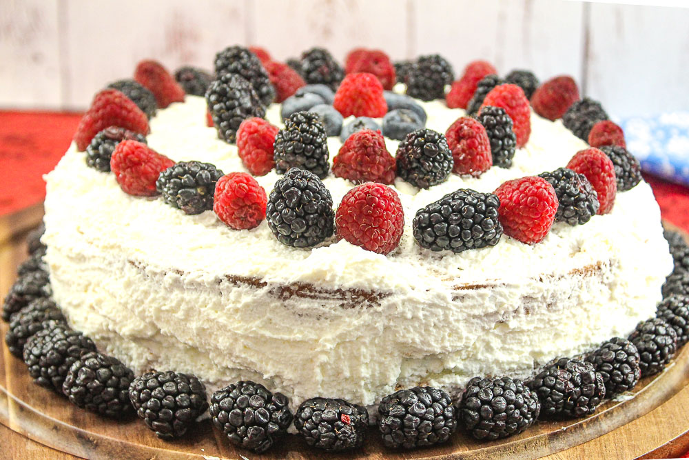 Cream Cake recipe with fresh berries and custard with whipped cream frosting