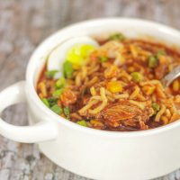 Bowl of Birria Ramen with hard boiled eggs