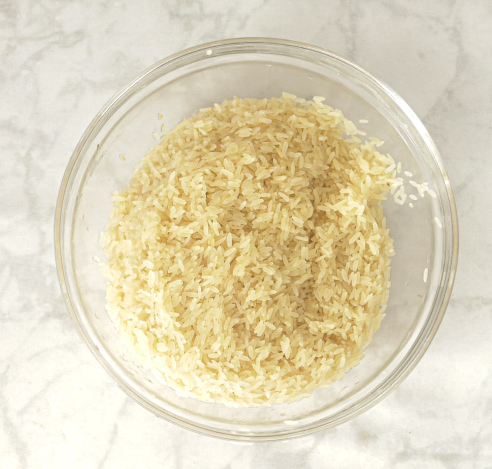 Washed bowl of parboiled rice