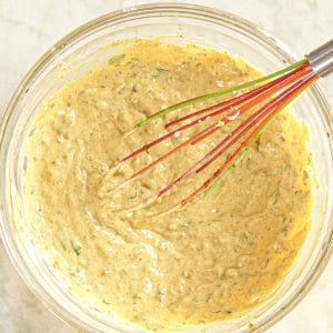 Remoulade Dressing in a bowl with whisk