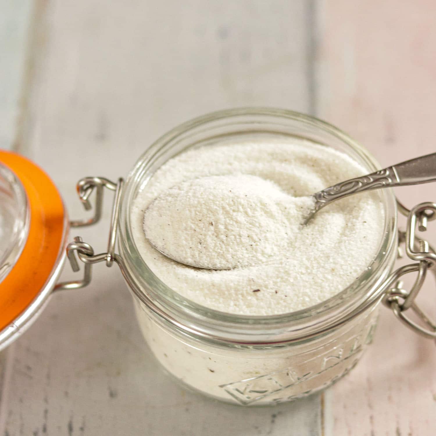 Homemade Vanilla Bean Sugar in a jar with a spoon #vanilla