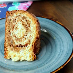 slice of Gubana Recipe - Italian Sweet Bread on a blue plate on a wooden table