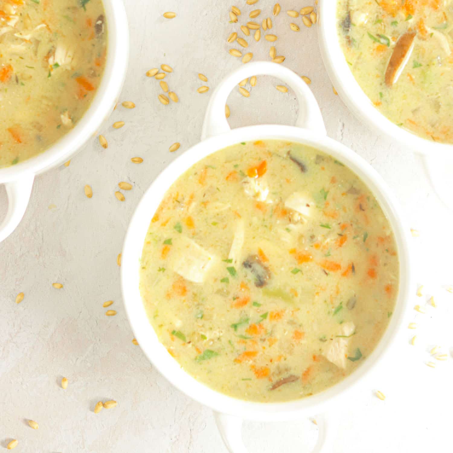 Chicken Soup in bowls with vegetables and wheat berries