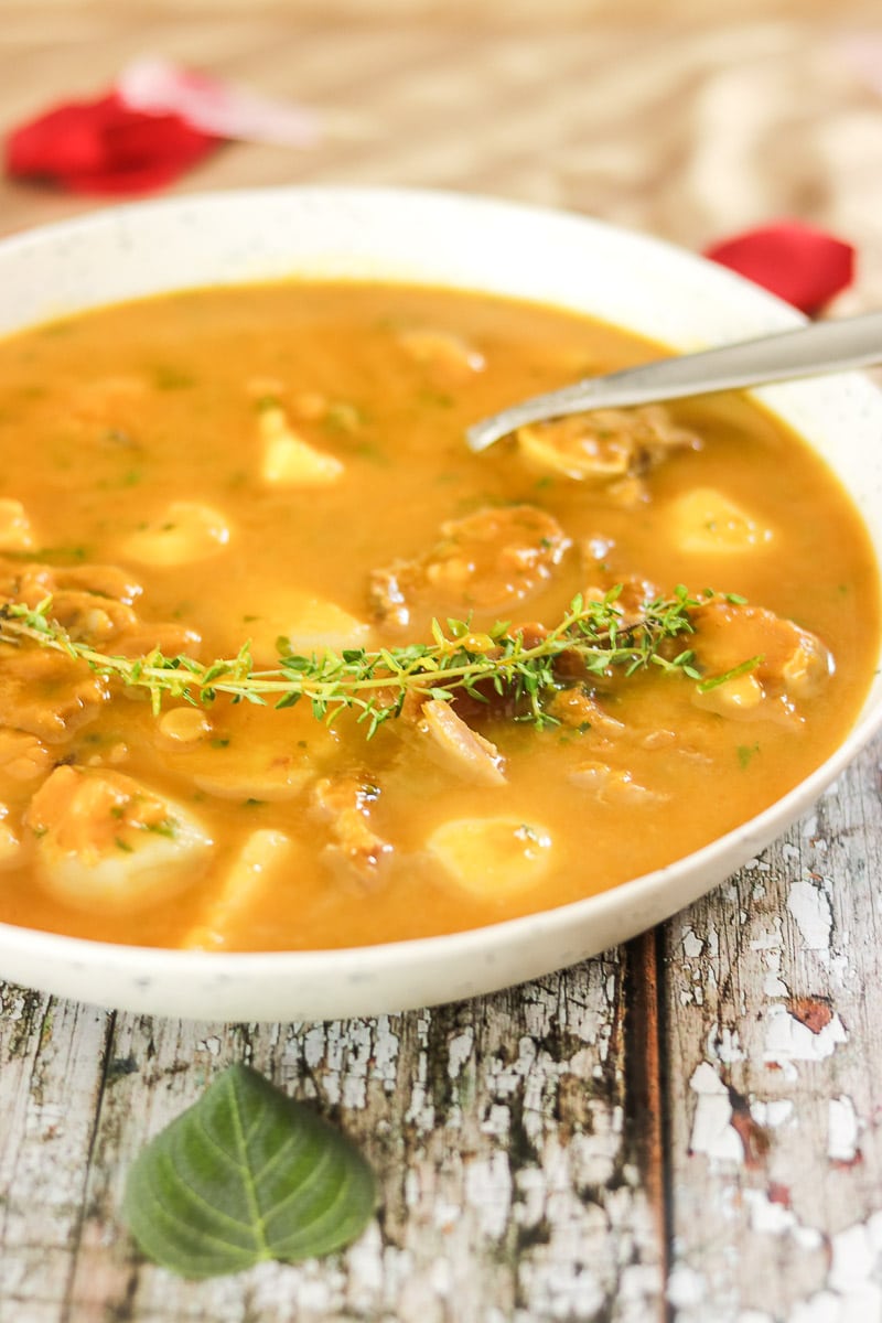 bowl of Caribbean Pumpkin Soup with fresh thyme