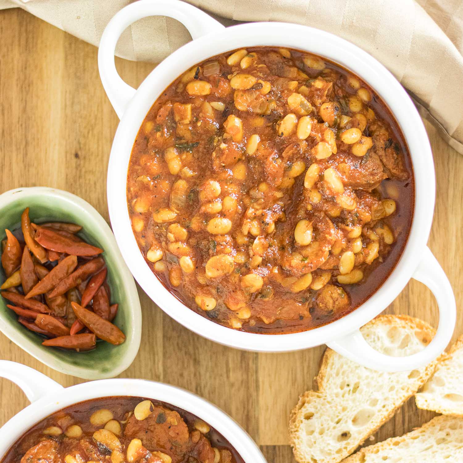 White Bean Stew in a bowl with Malagueta peppers