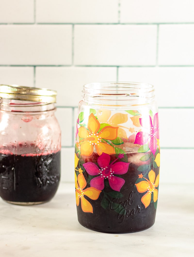 Hibiscus Tea in a pitcher with a small mason jar