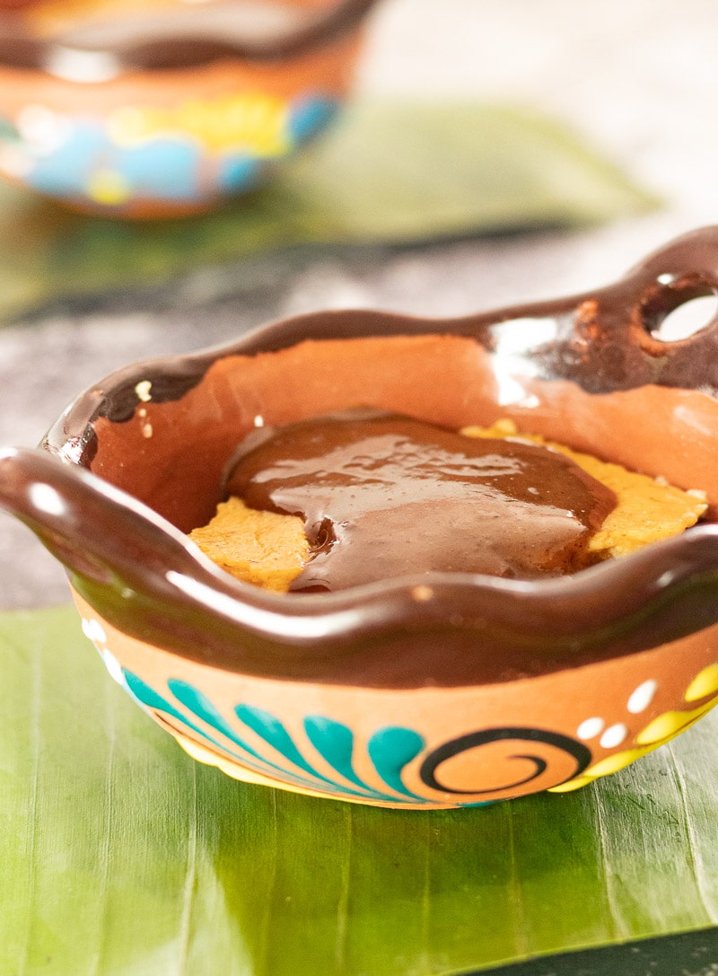 Champurrado Custard with chocolate sauce in a bowl