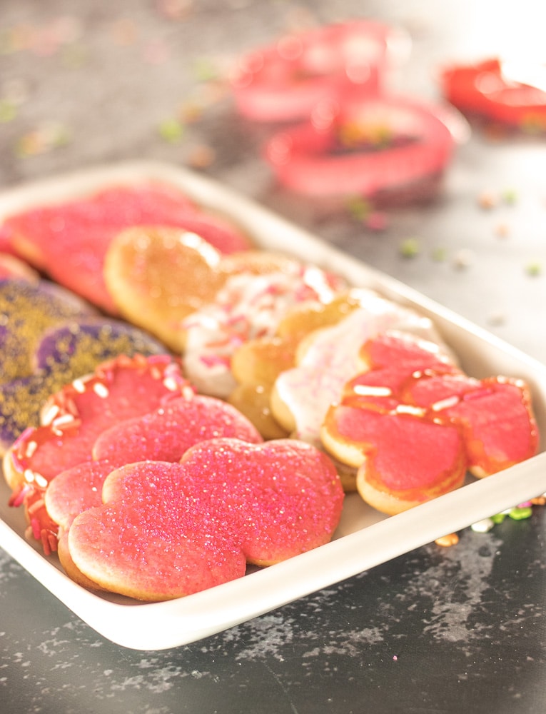 Pink Heart Shaped decorated cookies for Valentines Day on a white tray