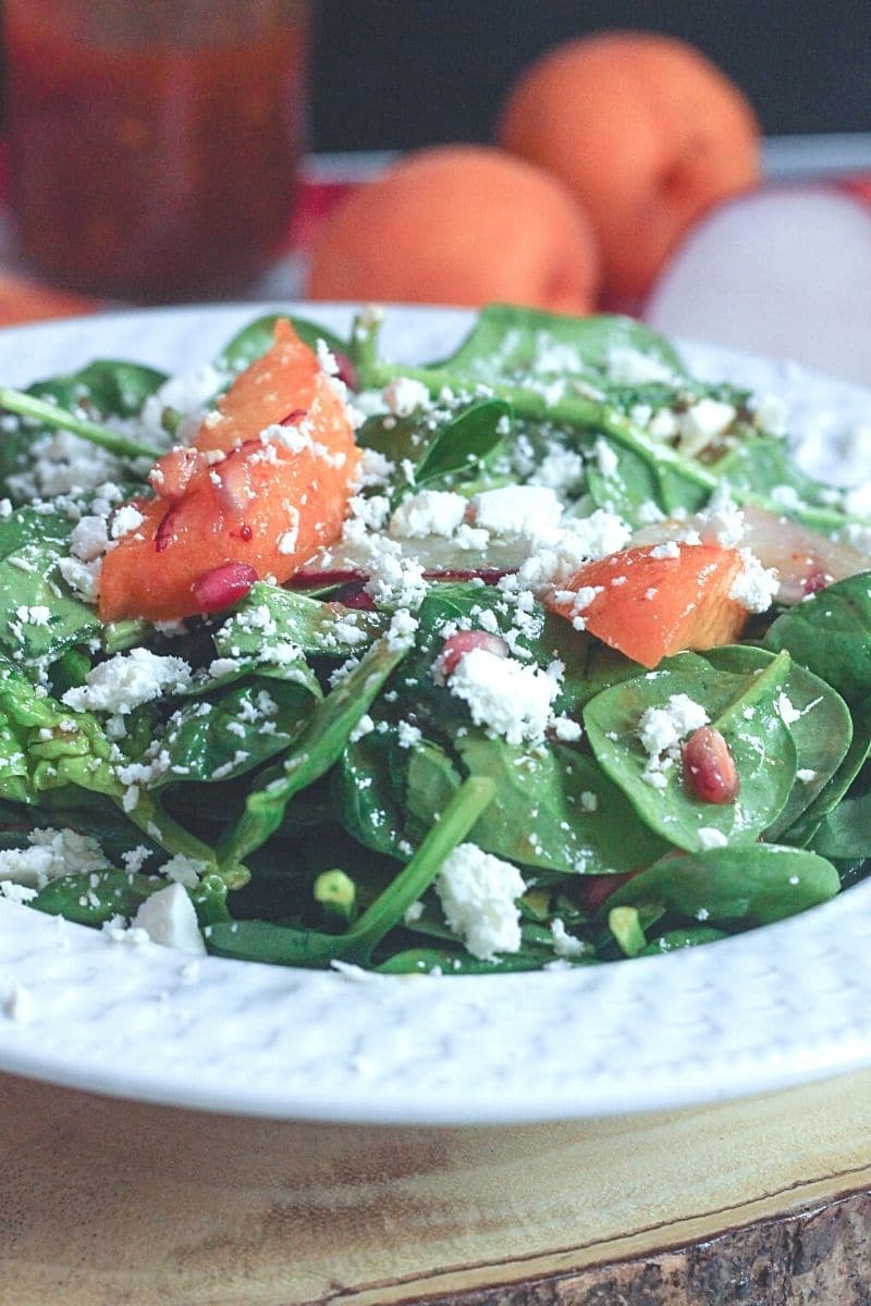 plate of Spinach Salad with Fresh apricots and Manouri cheese