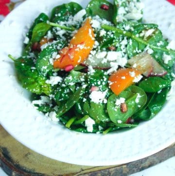 plate of Spinach Salad with fresh apricots