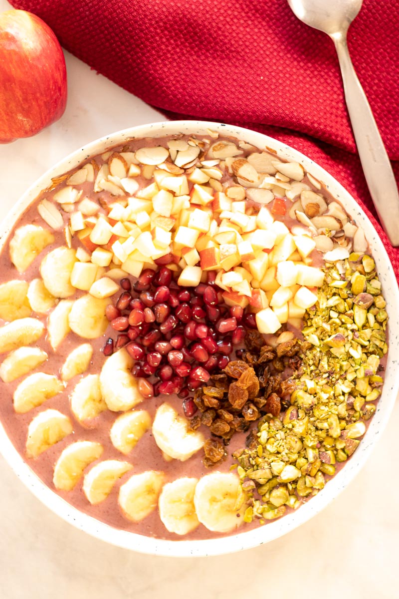 bowl of Acai Smoothie bowl loaded with fruits and nuts on top