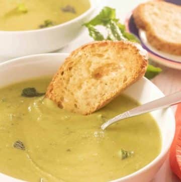 Vegetarian Green Pea Soup Recipe in a bowl with crusty bread