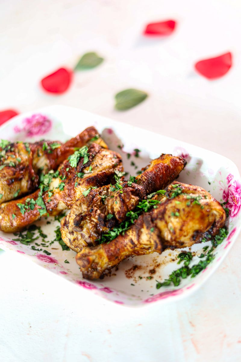 How to Make Masala Chicken Legs in the Air Fryer Recipe garnished with chopped cilantro.